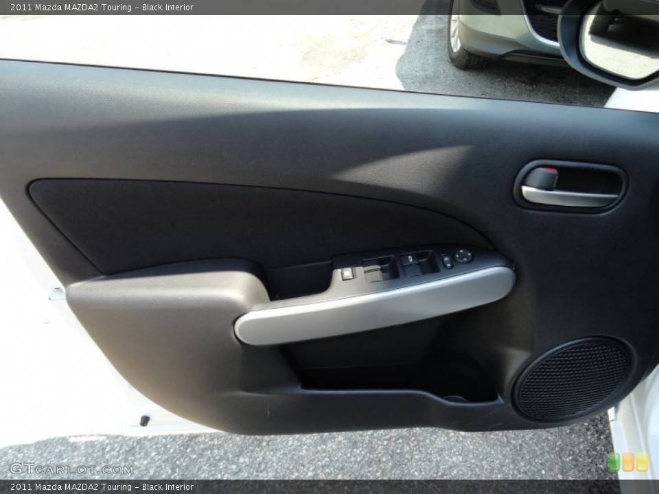 Black Interior Door Panel for the 2011 Mazda MAZDA2 Touring #51654415