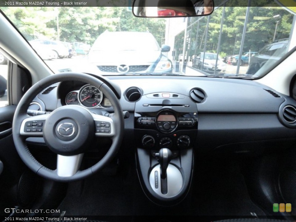 Black Interior Dashboard for the 2011 Mazda MAZDA2 Touring #51654457