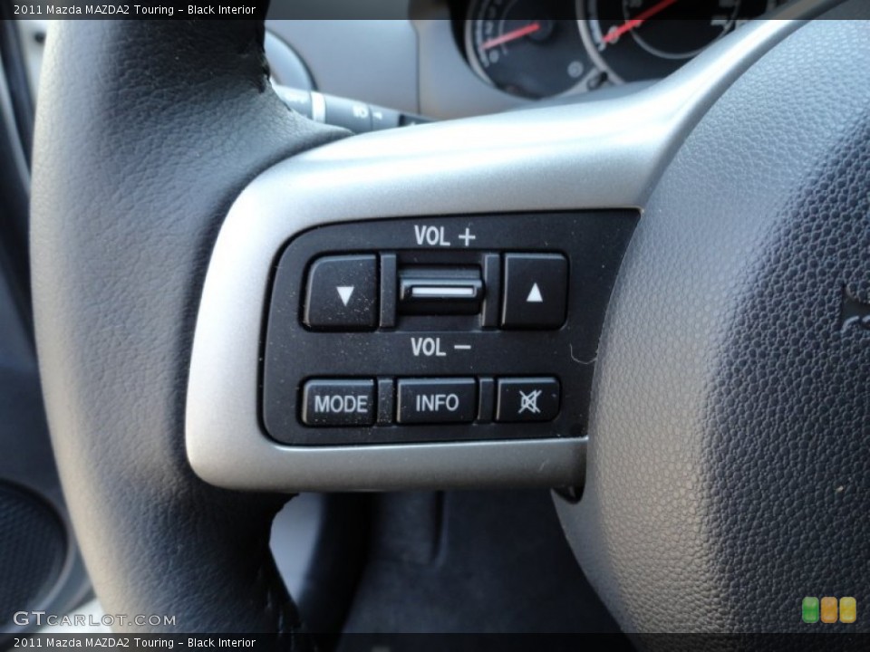 Black Interior Controls for the 2011 Mazda MAZDA2 Touring #51654487