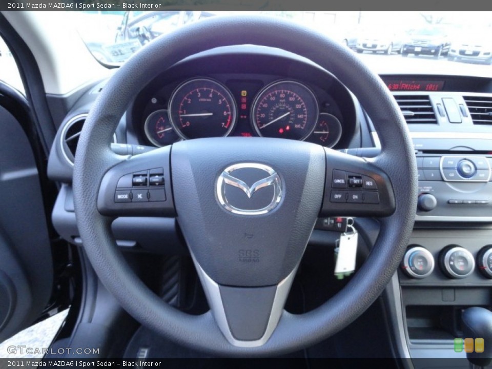 Black Interior Steering Wheel for the 2011 Mazda MAZDA6 i Sport Sedan #51670587
