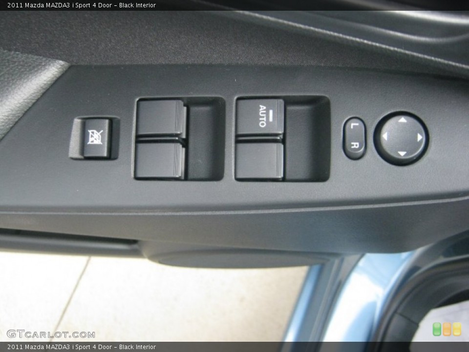 Black Interior Controls for the 2011 Mazda MAZDA3 i Sport 4 Door #51671598