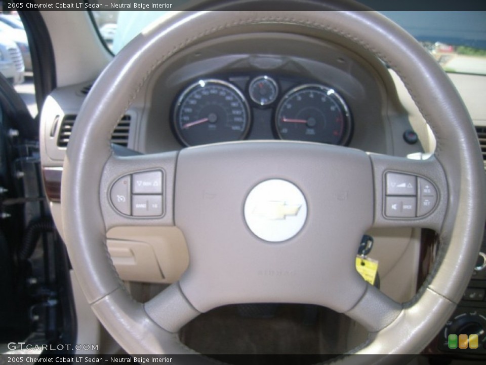 Neutral Beige Interior Steering Wheel for the 2005 Chevrolet Cobalt LT Sedan #51694825