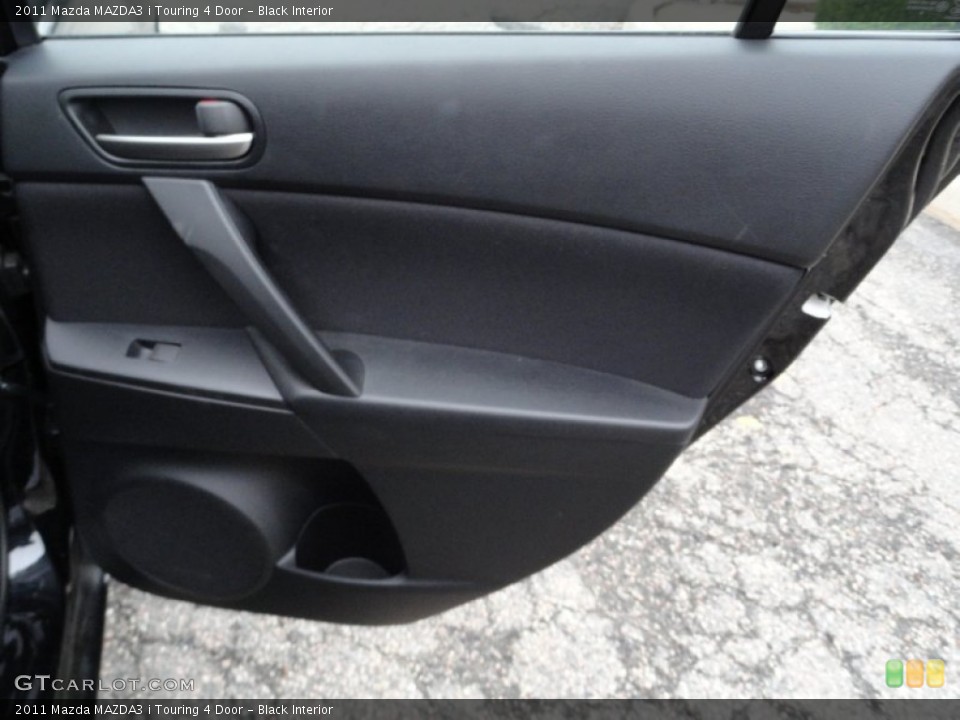 Black Interior Door Panel for the 2011 Mazda MAZDA3 i Touring 4 Door #51867028