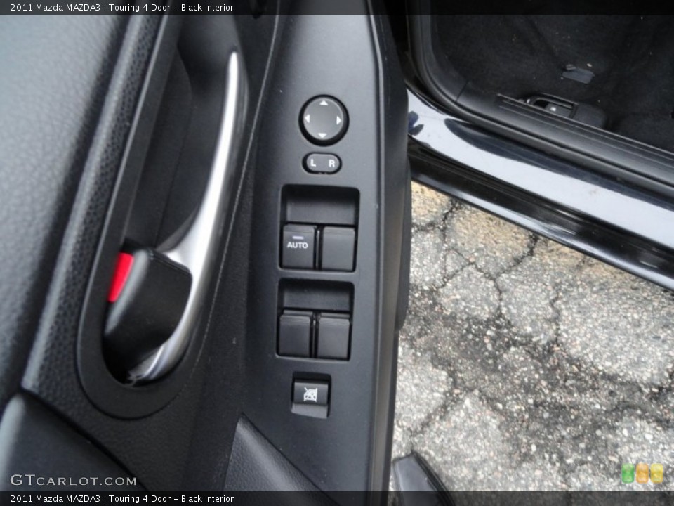 Black Interior Controls for the 2011 Mazda MAZDA3 i Touring 4 Door #51867124