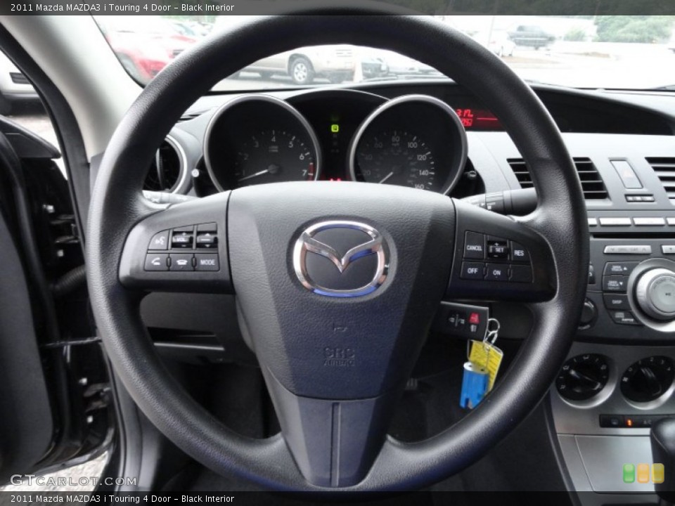 Black Interior Steering Wheel for the 2011 Mazda MAZDA3 i Touring 4 Door #51867178
