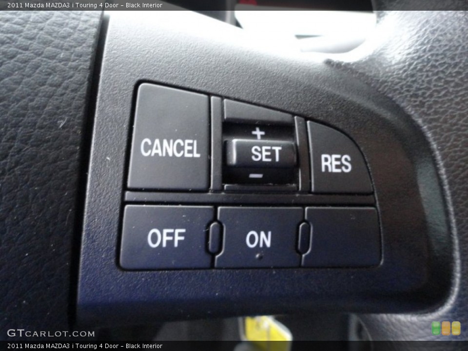 Black Interior Controls for the 2011 Mazda MAZDA3 i Touring 4 Door #51867211