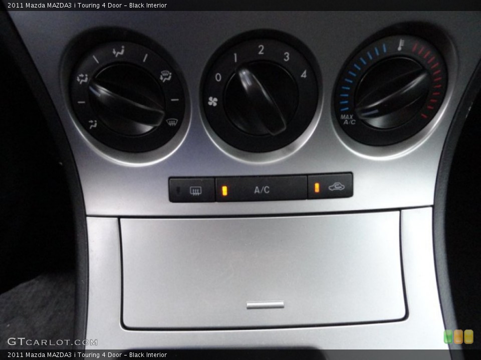 Black Interior Controls for the 2011 Mazda MAZDA3 i Touring 4 Door #51867286