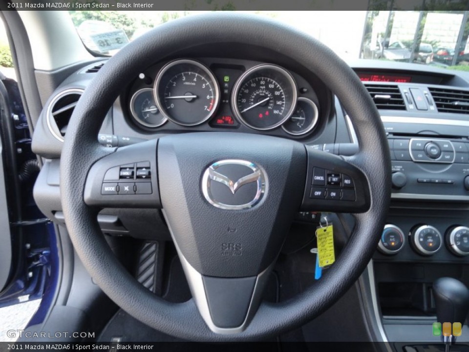 Black Interior Steering Wheel for the 2011 Mazda MAZDA6 i Sport Sedan #51980039