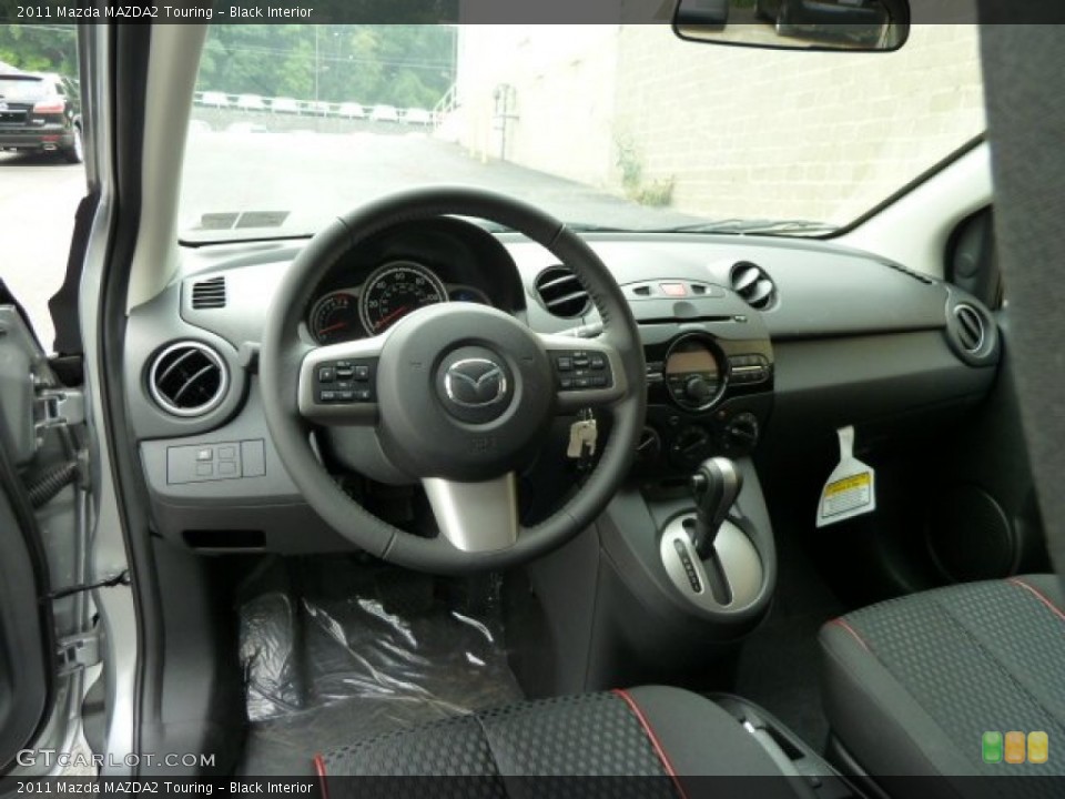 Black Interior Dashboard for the 2011 Mazda MAZDA2 Touring #52014282
