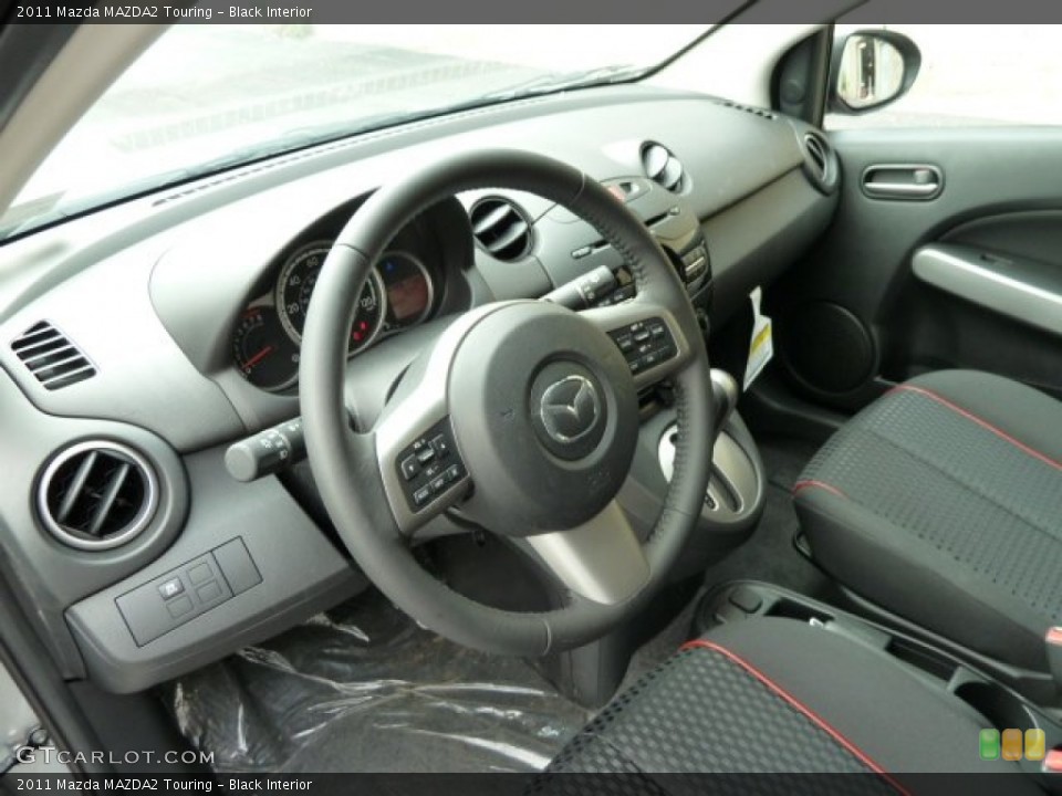 Black Interior Prime Interior for the 2011 Mazda MAZDA2 Touring #52014324