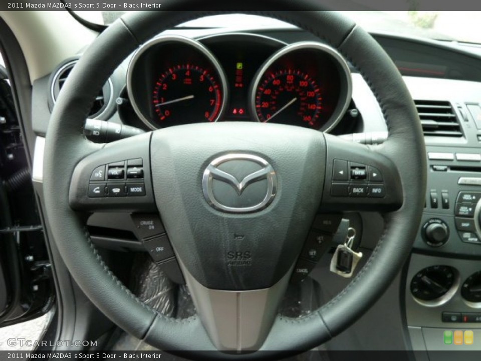 Black Interior Steering Wheel for the 2011 Mazda MAZDA3 s Sport 5 Door #52016343