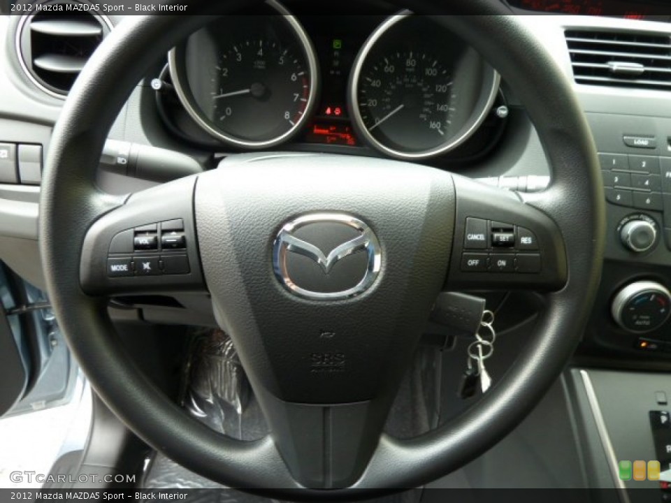 Black Interior Steering Wheel for the 2012 Mazda MAZDA5 Sport #52021194