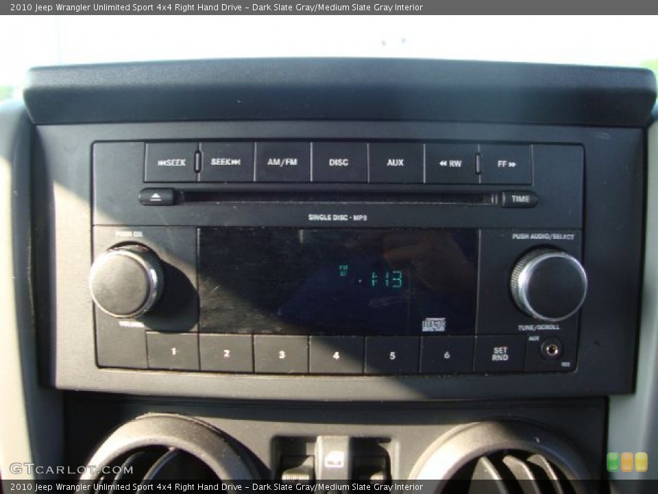 Dark Slate Gray/Medium Slate Gray Interior Controls for the 2010 Jeep Wrangler Unlimited Sport 4x4 Right Hand Drive #52102436