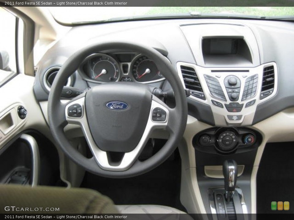 Light Stone/Charcoal Black Cloth Interior Dashboard for the 2011 Ford Fiesta SE Sedan #52114039