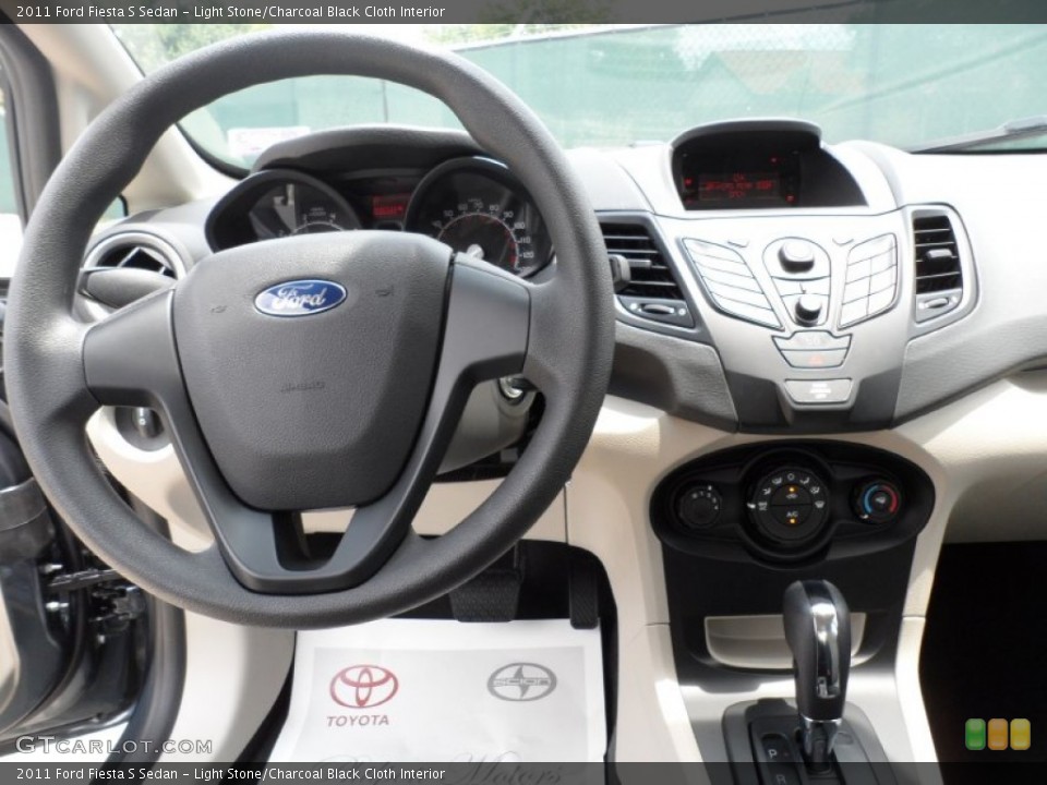 Light Stone/Charcoal Black Cloth Interior Dashboard for the 2011 Ford Fiesta S Sedan #52127983