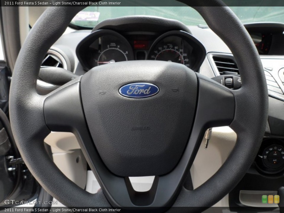 Light Stone/Charcoal Black Cloth Interior Steering Wheel for the 2011 Ford Fiesta S Sedan #52128073