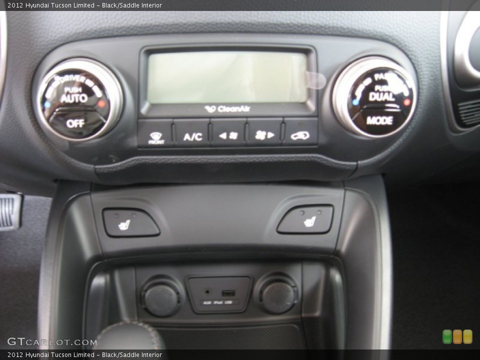 Black/Saddle Interior Controls for the 2012 Hyundai Tucson Limited #52156980