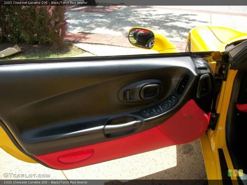 Black/Torch Red Interior Door Panel for the 2003 Chevrolet Corvette Z06 #52242583