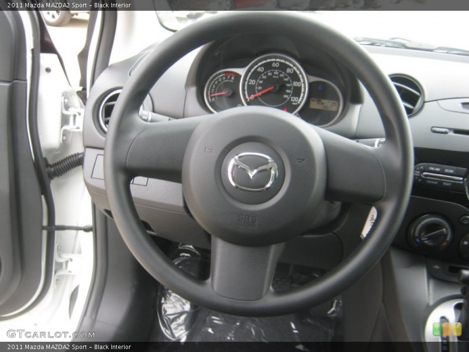 Black Interior Steering Wheel for the 2011 Mazda MAZDA2 Sport #52315743