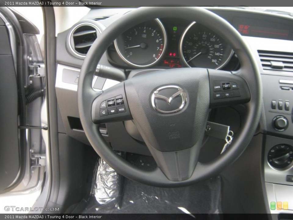 Black Interior Steering Wheel for the 2011 Mazda MAZDA3 i Touring 4 Door #52317906