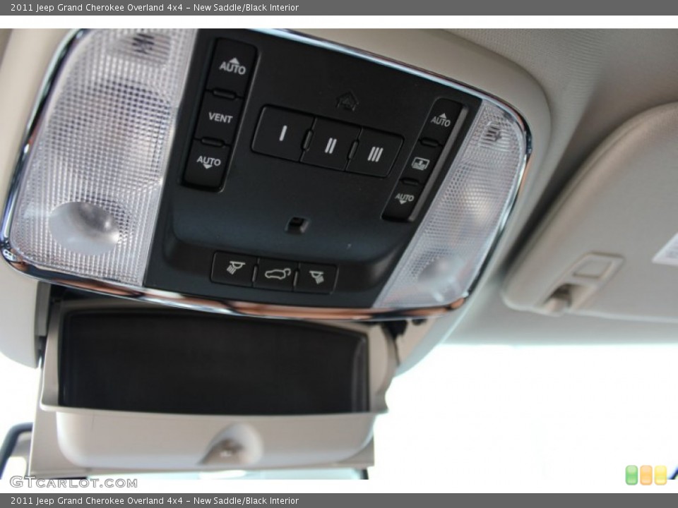 New Saddle/Black Interior Controls for the 2011 Jeep Grand Cherokee Overland 4x4 #52340676