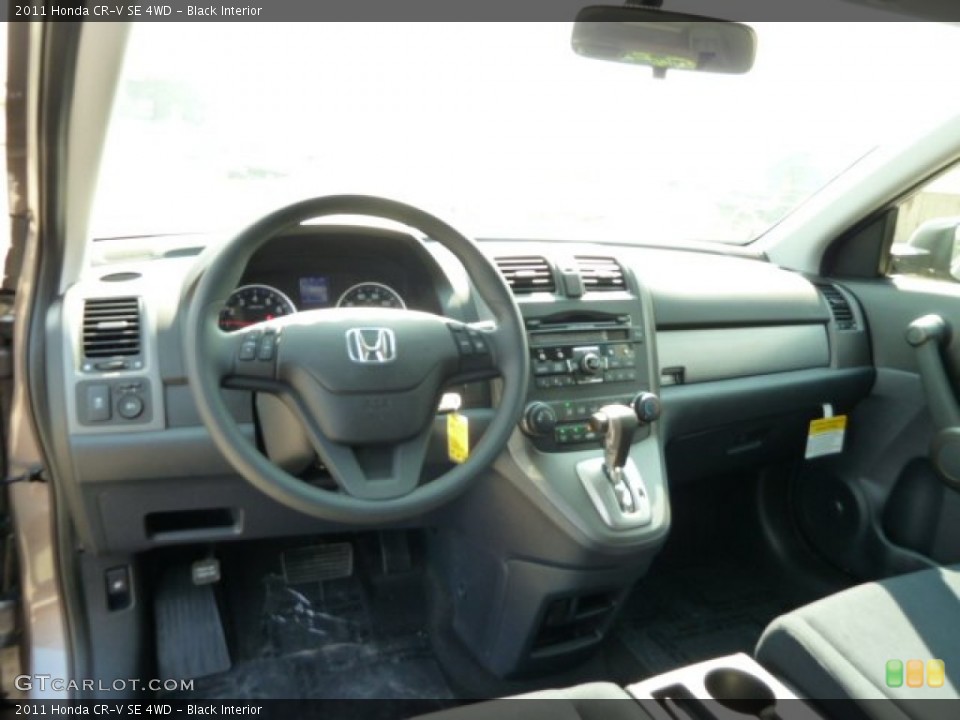 Black Interior Dashboard for the 2011 Honda CR-V SE 4WD #52474802