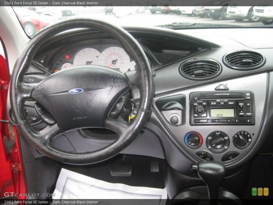 Dark Charcoal Black Interior Dashboard for the 2001 Ford Focus SE Sedan #52563107