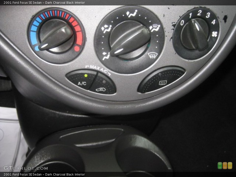 Dark Charcoal Black Interior Controls for the 2001 Ford Focus SE Sedan #52563434