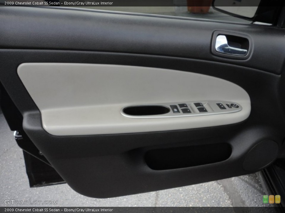 Ebony/Gray UltraLux Interior Door Panel for the 2009 Chevrolet Cobalt SS Sedan #52575998