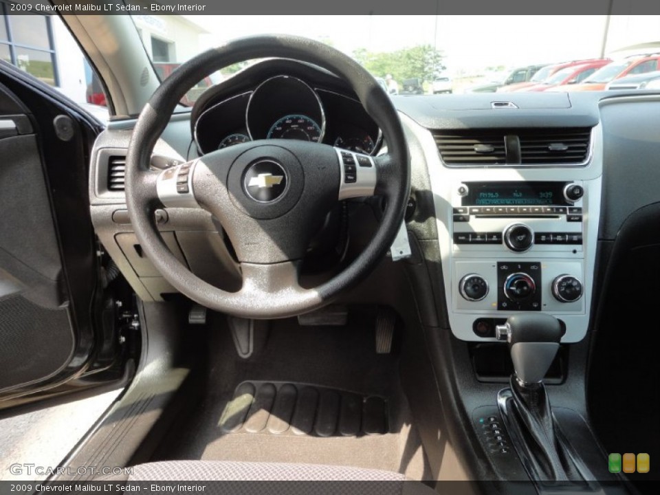 Ebony Interior Dashboard for the 2009 Chevrolet Malibu LT Sedan #52615679