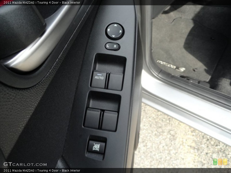 Black Interior Controls for the 2011 Mazda MAZDA3 i Touring 4 Door #52673380