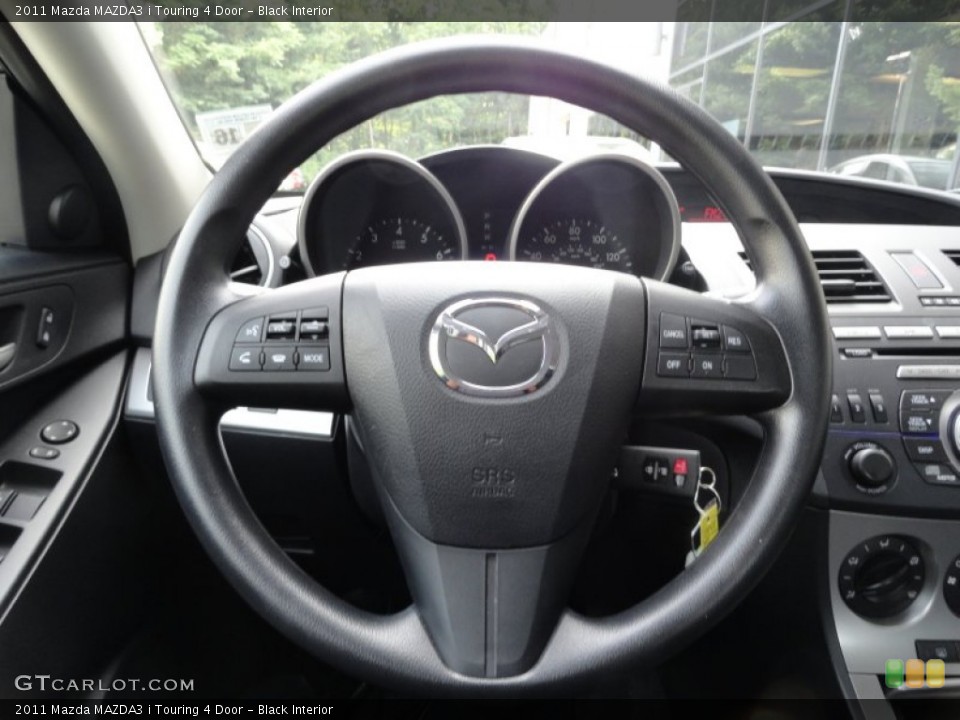 Black Interior Steering Wheel for the 2011 Mazda MAZDA3 i Touring 4 Door #52673416