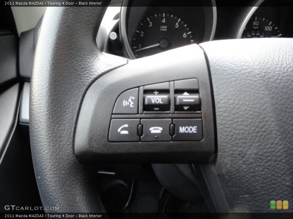 Black Interior Controls for the 2011 Mazda MAZDA3 i Touring 4 Door #52673428