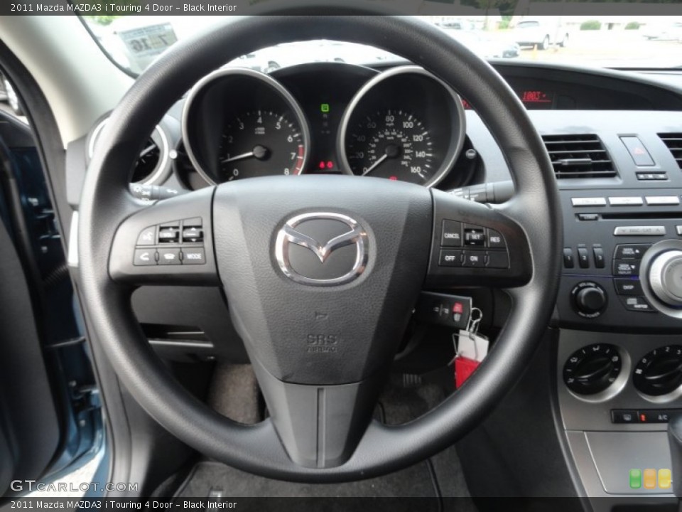 Black Interior Steering Wheel for the 2011 Mazda MAZDA3 i Touring 4 Door #52674172