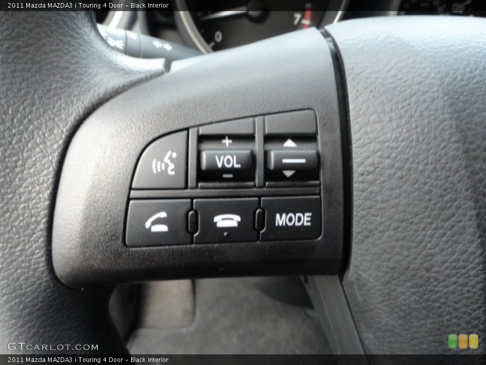 Black Interior Controls for the 2011 Mazda MAZDA3 i Touring 4 Door #52674184