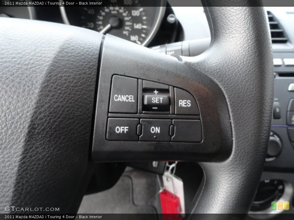 Black Interior Controls for the 2011 Mazda MAZDA3 i Touring 4 Door #52674196