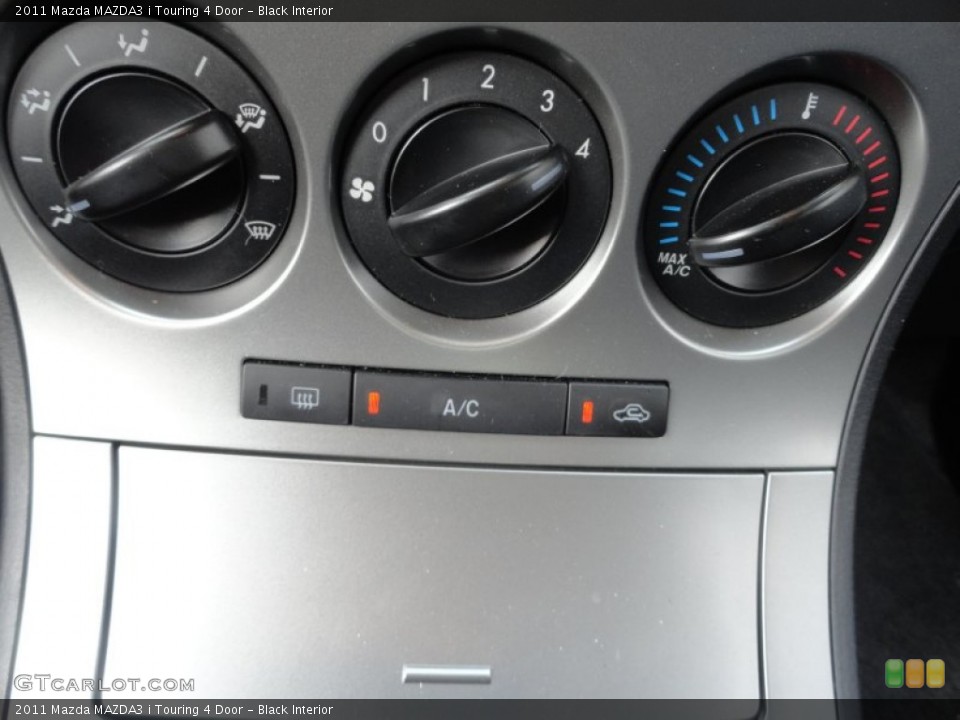 Black Interior Controls for the 2011 Mazda MAZDA3 i Touring 4 Door #52674256
