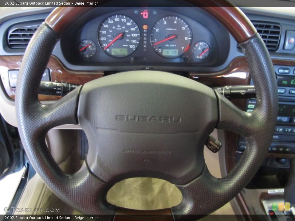 Beige Interior Steering Wheel for the 2002 Subaru Outback Limited Sedan #52864540