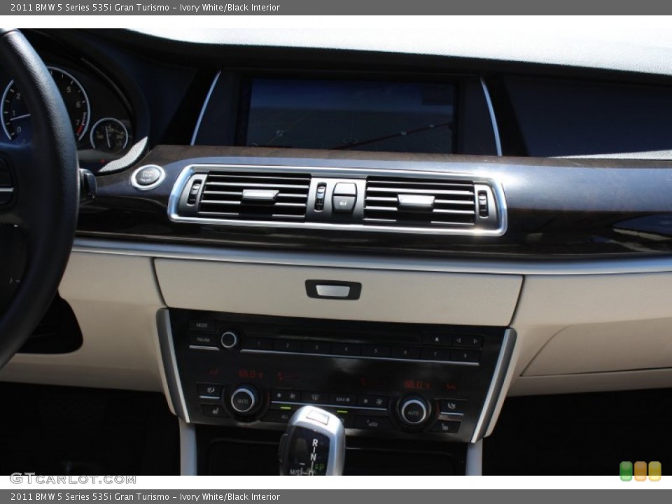 Ivory White/Black Interior Controls for the 2011 BMW 5 Series 535i Gran Turismo #52909107