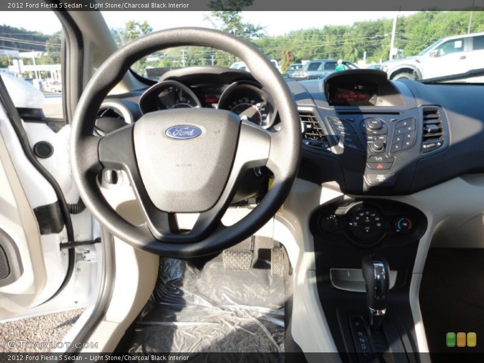 Light Stone/Charcoal Black Interior Steering Wheel for the 2012 Ford Fiesta S Sedan #53083264