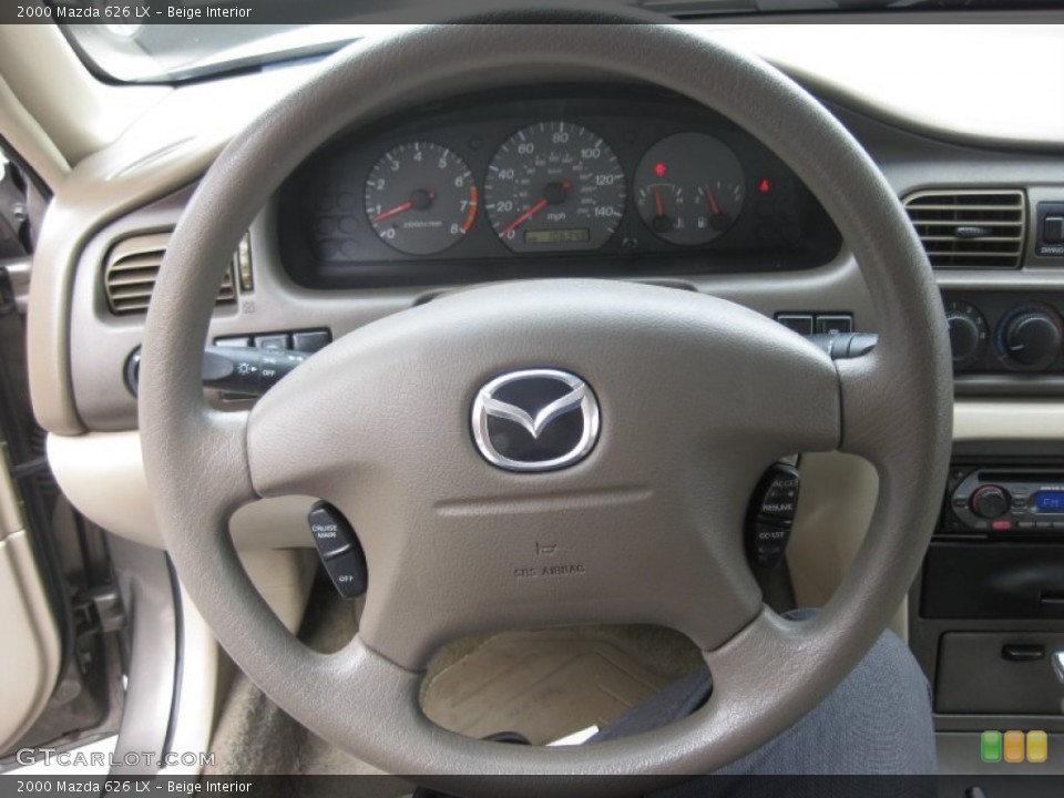 Beige Interior Steering Wheel for the 2000 Mazda 626 LX #53087237