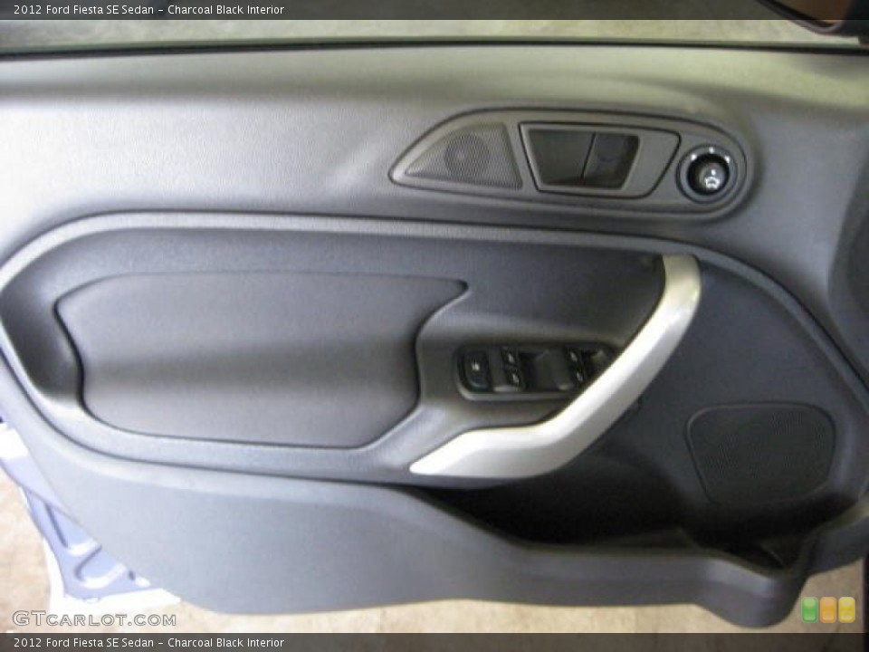 Charcoal Black Interior Door Panel for the 2012 Ford Fiesta SE Sedan #53130304