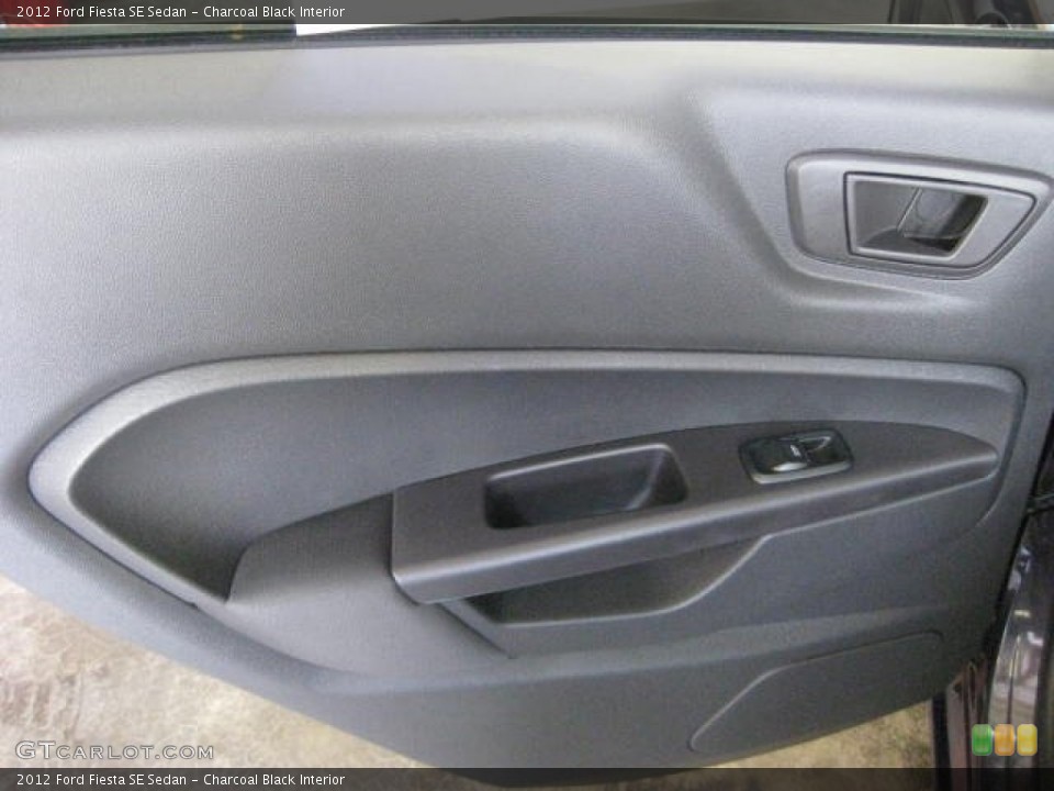 Charcoal Black Interior Door Panel for the 2012 Ford Fiesta SE Sedan #53130325