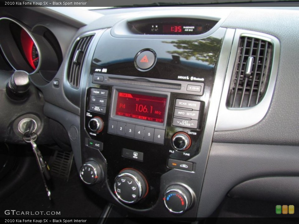 Black Sport Interior Controls for the 2010 Kia Forte Koup SX #53208692