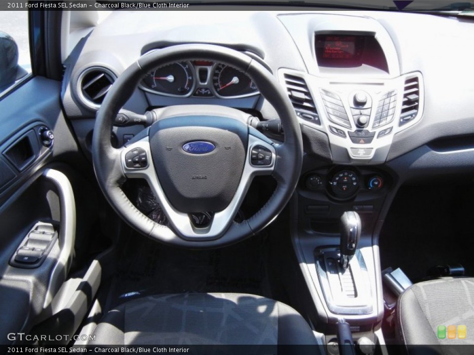 Charcoal Black/Blue Cloth Interior Dashboard for the 2011 Ford Fiesta SEL Sedan #53329614