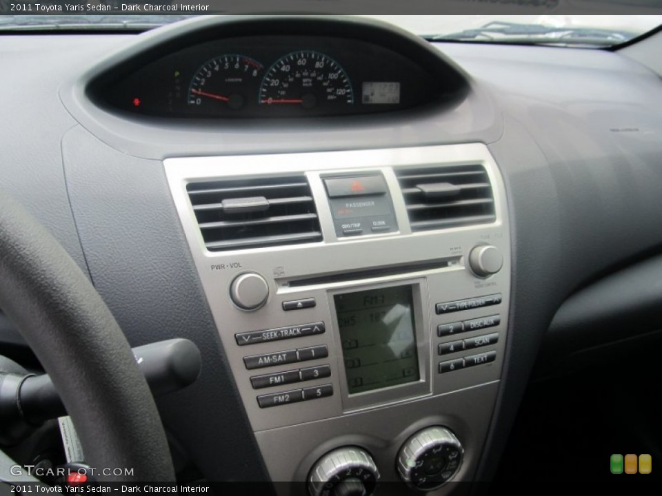 Dark Charcoal Interior Controls for the 2011 Toyota Yaris Sedan #53425148