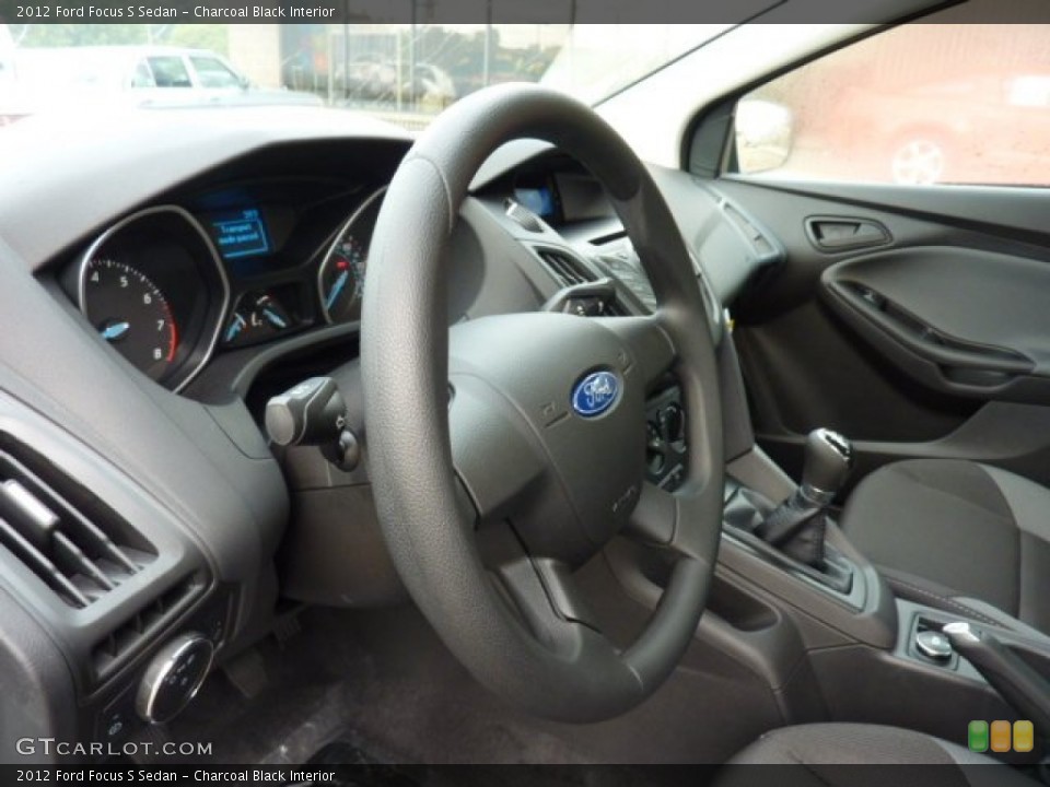 Charcoal Black Interior Steering Wheel for the 2012 Ford Focus S Sedan #53486603