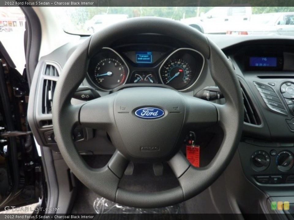 Charcoal Black Interior Steering Wheel for the 2012 Ford Focus S Sedan #53486630