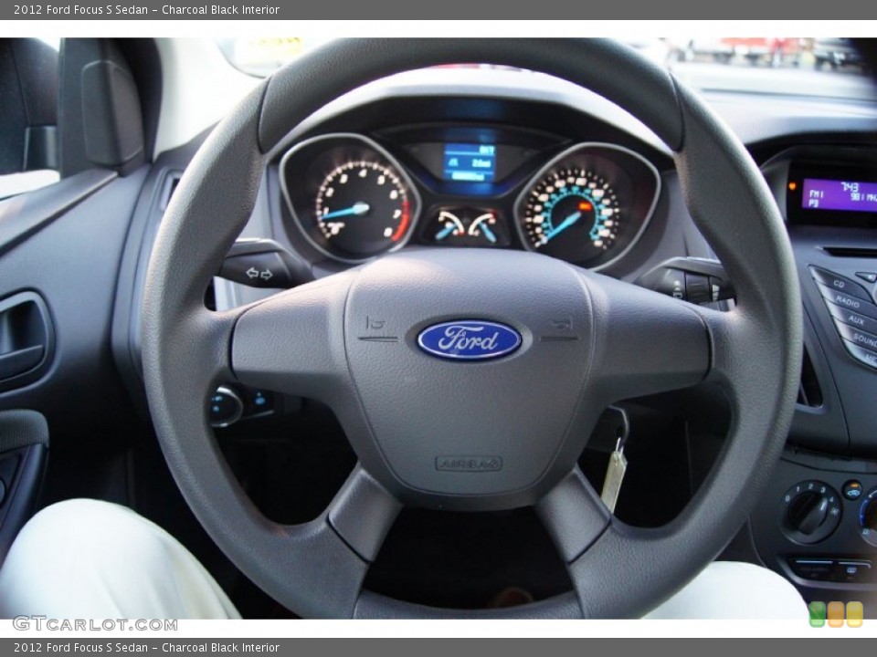 Charcoal Black Interior Steering Wheel for the 2012 Ford Focus S Sedan #53502901