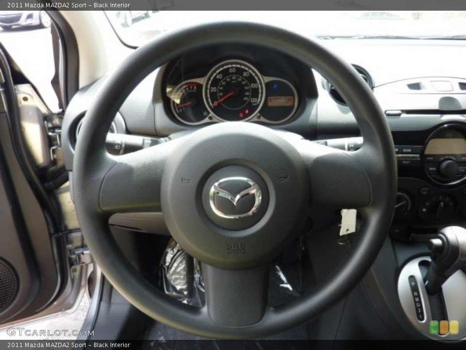 Black Interior Steering Wheel for the 2011 Mazda MAZDA2 Sport #53588914